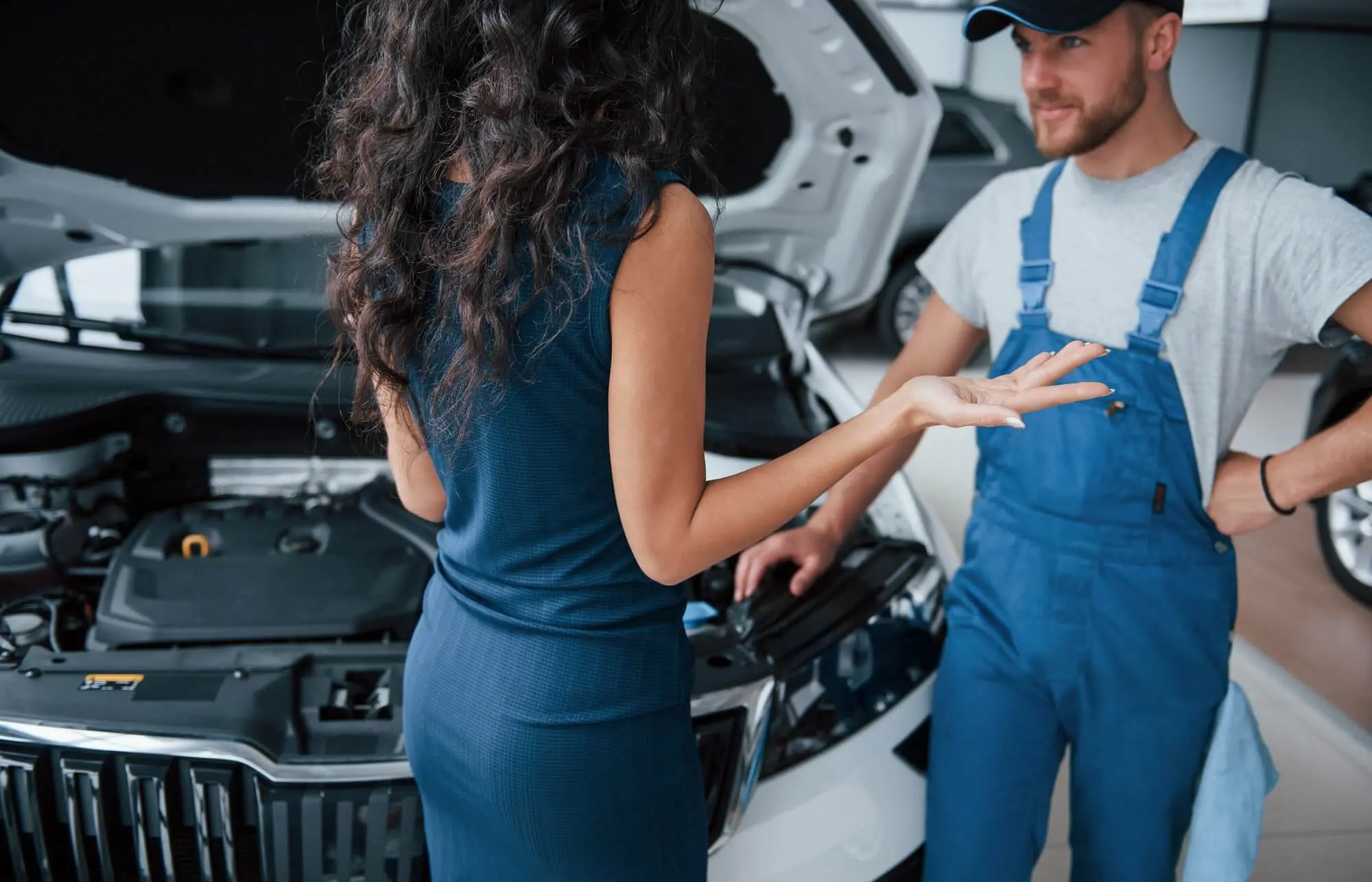 Driver collecting her car from the workshop after a tyre blowout replacement